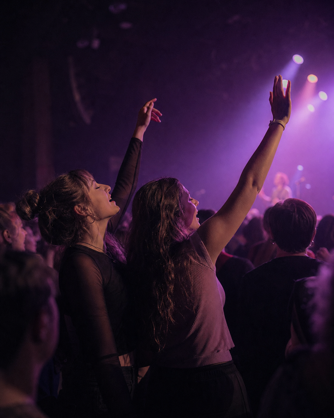 Two friends enjoying the show near the front of the crowd